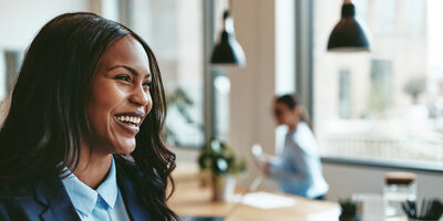 business woman smiling and looking away from camera